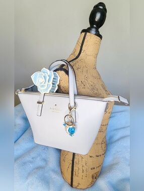 Kate Spade Cedar Street Harmony Bag In Mystic Blue & Charm With Flower Clip